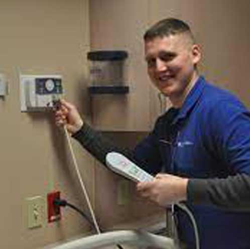Photo of Winward Electric employee installing